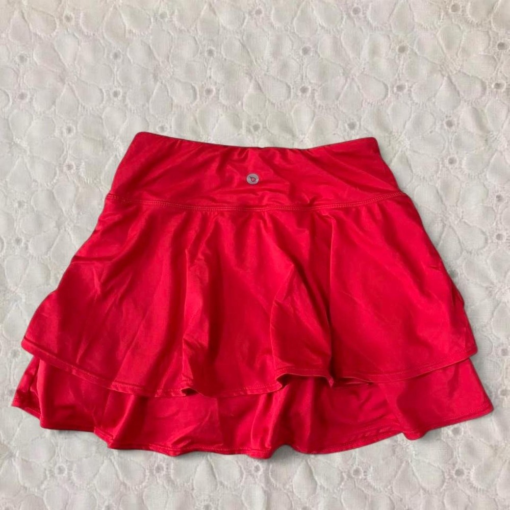 Red Baleaf tennis skirt in XS in excellent condition with under shorts